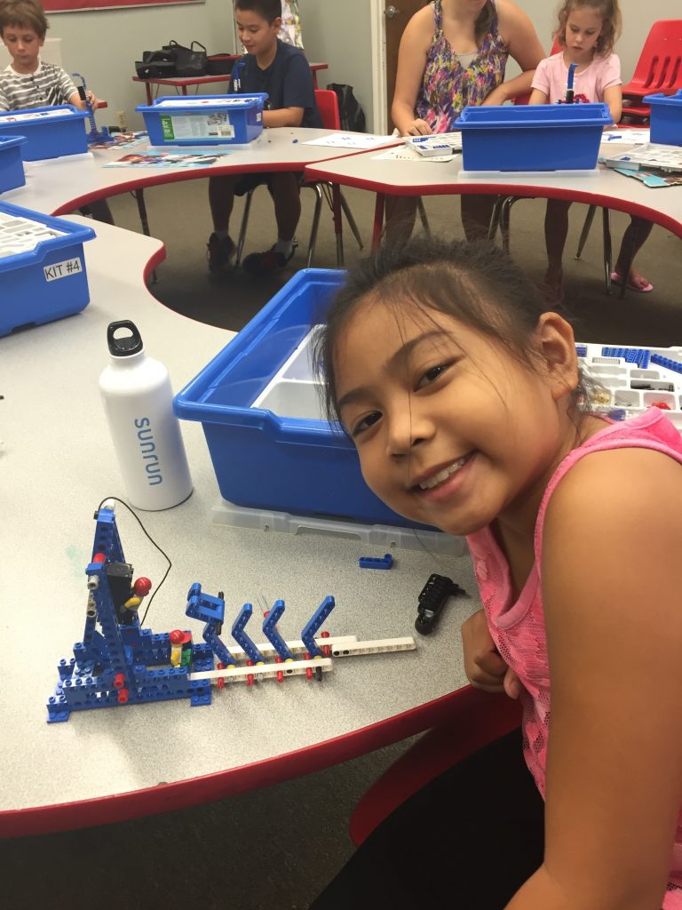 Elementary school student practices engineering with LEGOs in Long Beach