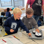 Shared Science Long Beach elementary school students working with Root robots