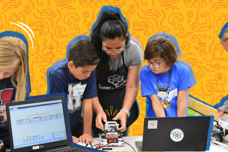 Students and teacher learning about robots.